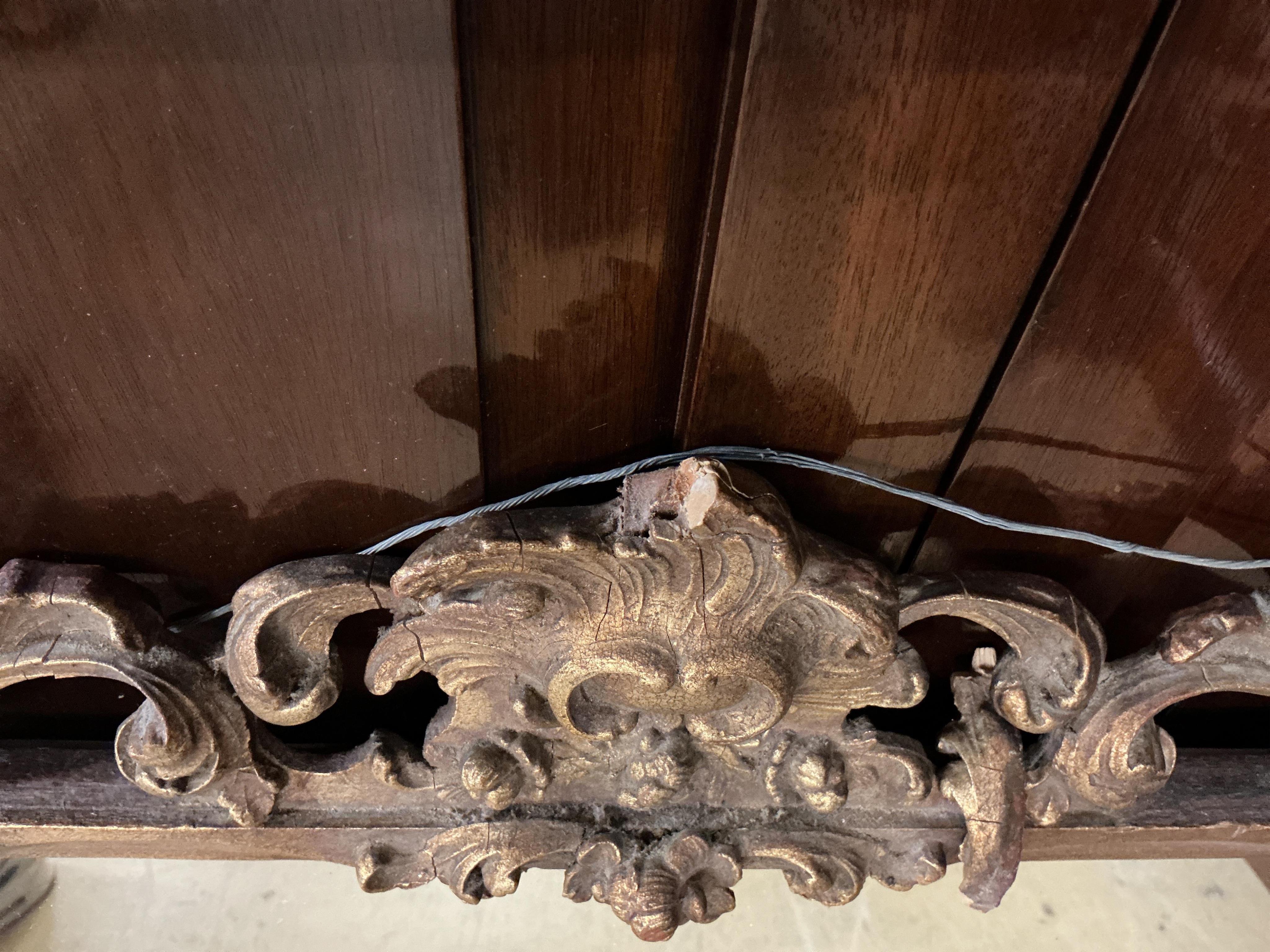 A giltwood mirror with openwork surround, width 88cm, height 70cm